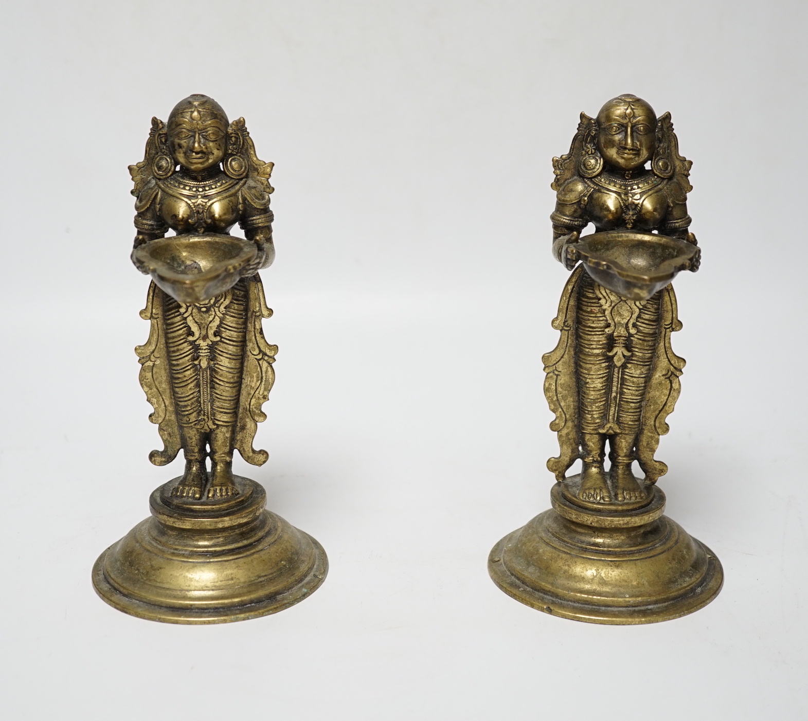 A pair of 19th century Indian ‘Deepalakshni’ butter oil lamps, 19cm high